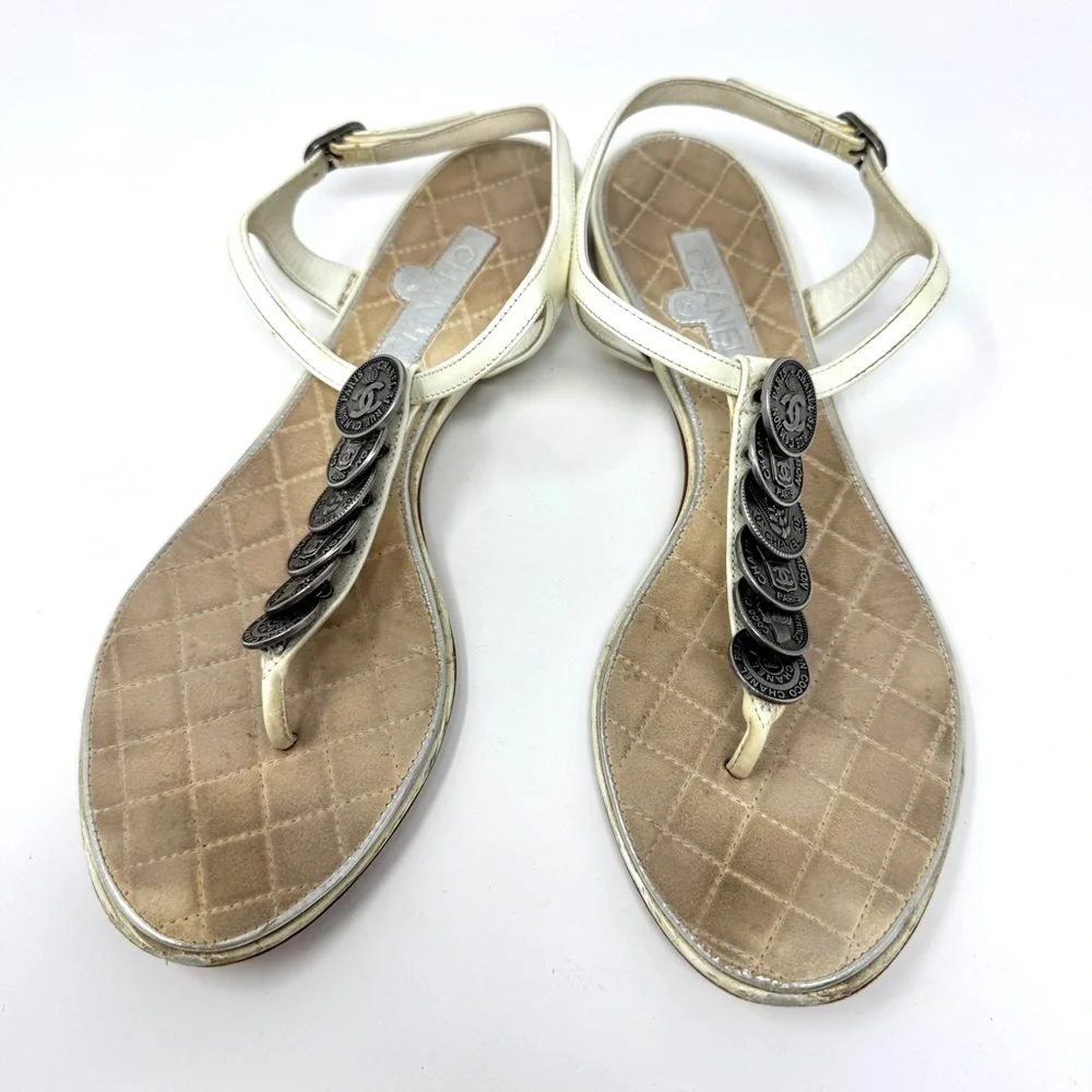 CHANEL White Leather Thong Sandals with Stacked Silver Coin Medallions